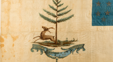 Bucks of America flag with deer with deer, 松树, a large cartouche with “The Bucks of America”, and smaller cartouche at the top of the image containing the initials “J-G-W-H."